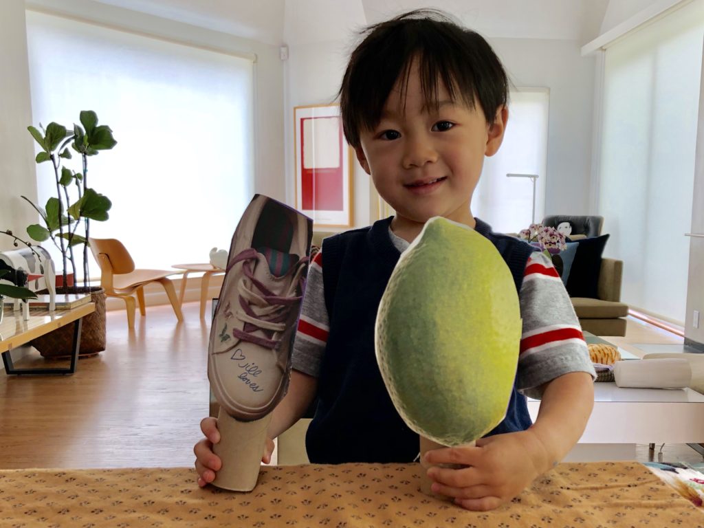 Master N was not quite three when he made these puppets with a little help. A slightly older child could make these with child safety scissors.
