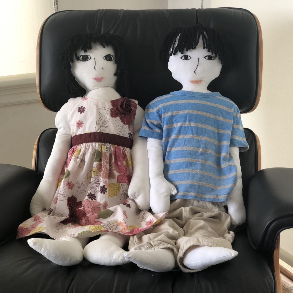 These dolls are made to size by tracing the child's body on paper, transferring to fabric, then sewing and stuffing.