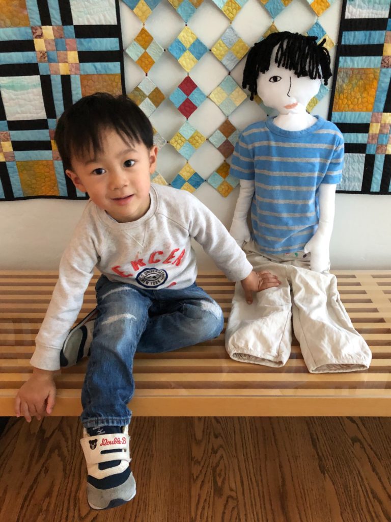 Master N and his life-size doll, made by tracing the child's silhouette to make a customized pattern.