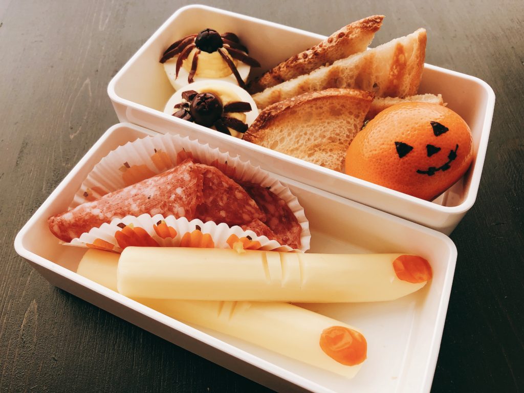 String cheese "fingers," spider deviled eggs, and clementine jack-o'-lanterns are Halloween snacks that can fill a lunchbox, too.