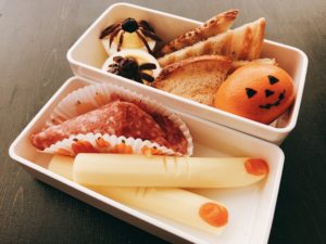 Creepy Fingers, olive spider and tangerine jack-o-lantern make up this themed bento lunch for kids.