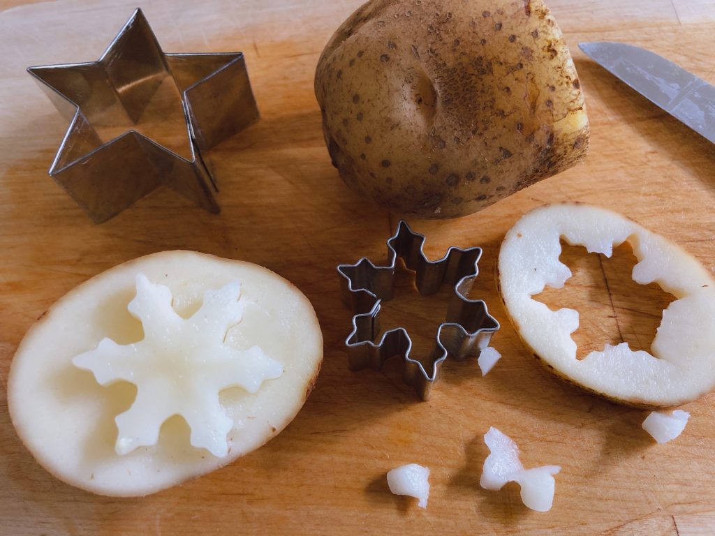 Once the margins are cut around the potato, the design stands out in relief.