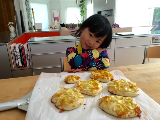 Some of the pizzas made by a three-year-old.