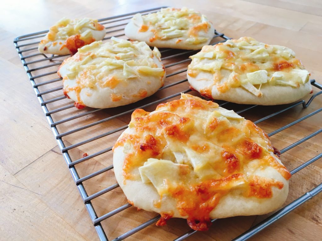 Chopped apple and Cheddar cheese make a delicious snack pizza.