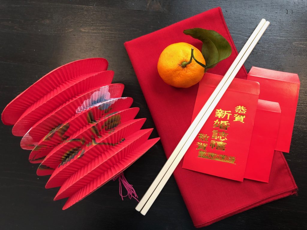 Red lanterns, chopsticks and red envelopes with lucky money for the grandkids are easy props for a Chinese New Year dinner.