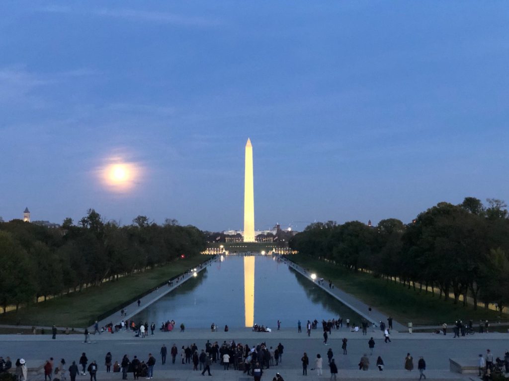 Washington Monument, as seen from the Lincoln Memorial as night falls.