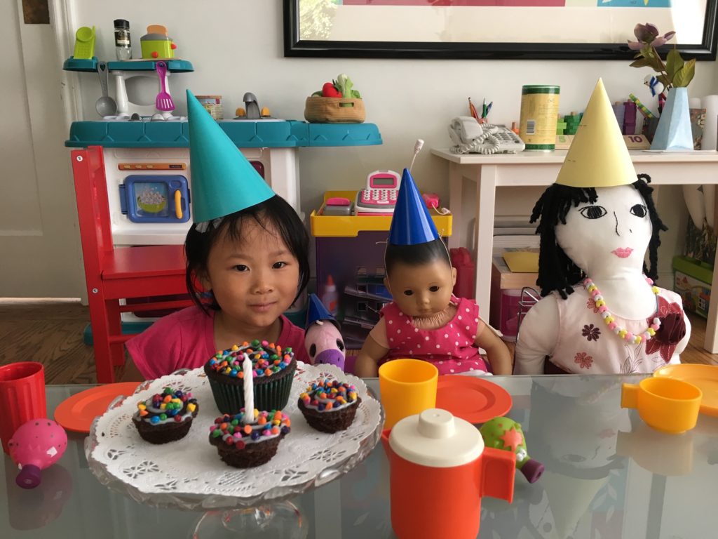 Miss T and the dolls gather to celebrate Lucy's first birthday.