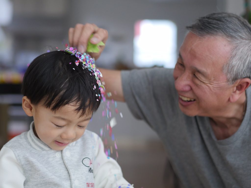 Grandpa crushes an egg to set confetti flying.