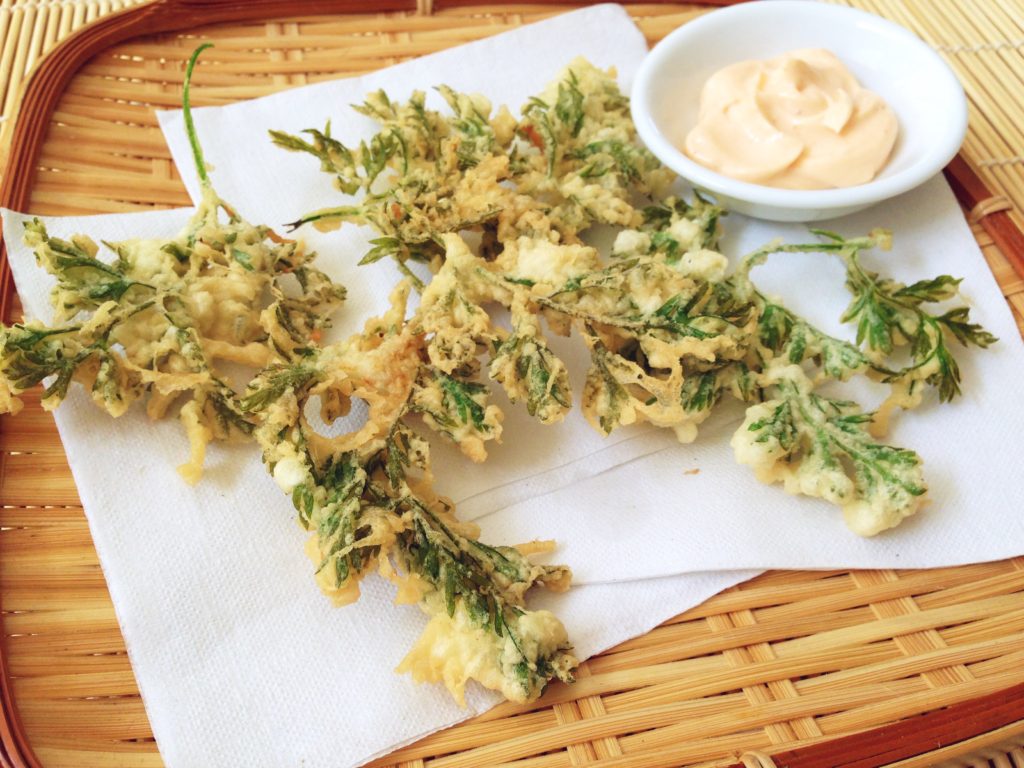 Leafy tempura made with throwaway carrot tops are light, crisp and delicious. Serve with a dip of sriracha and mayonnaise.
