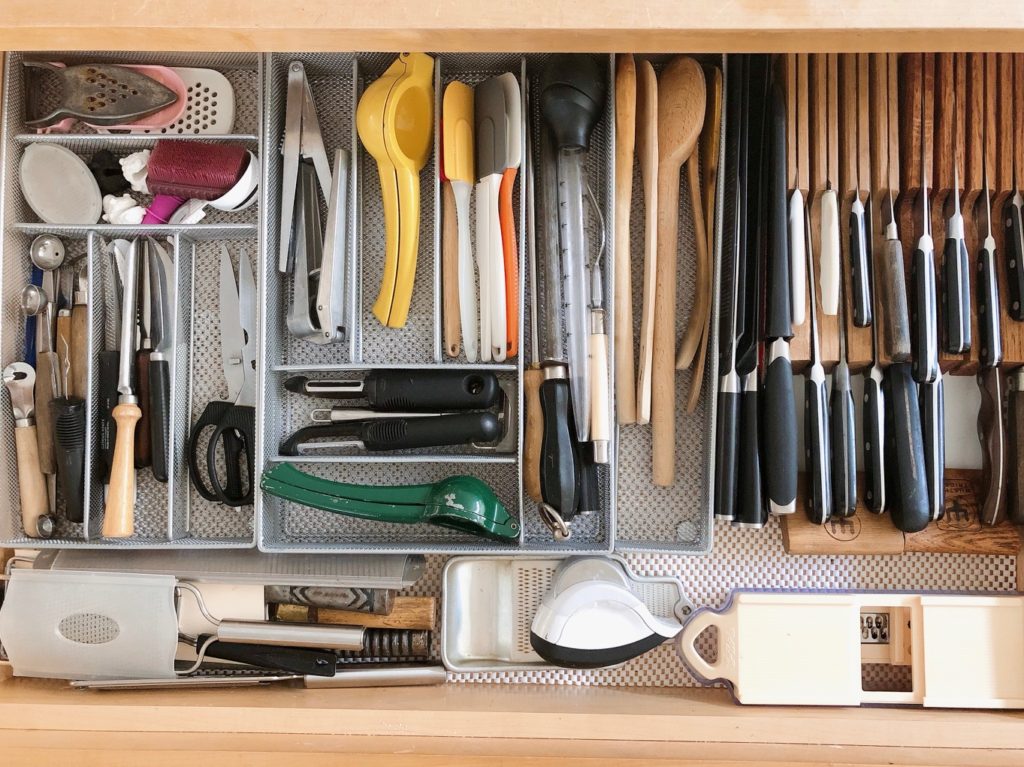 Sorting out kitchen utensils and organizing them makes cooking more efficient later.