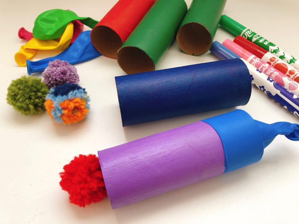 Pom pom canons are easy to make and fun to play. It's a simple toilet paper roll craft.
