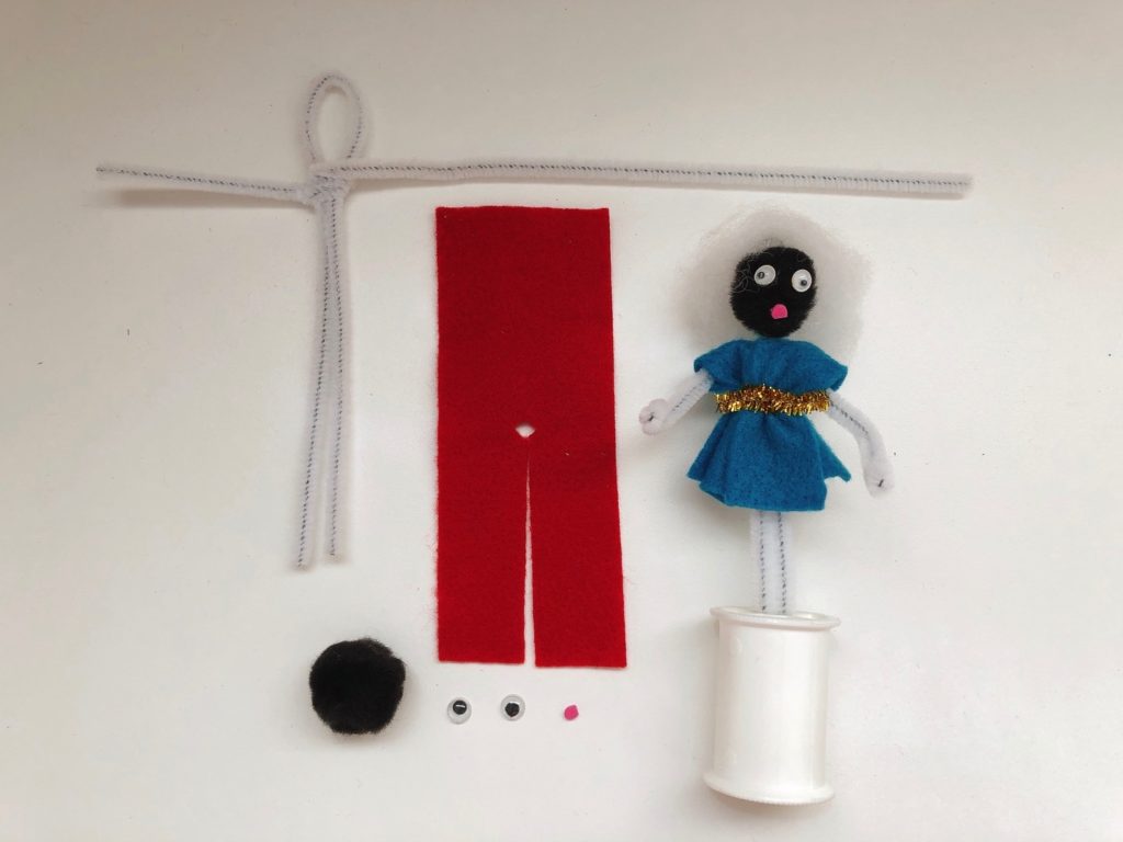 To make the pipe cleaner doll, fashion the body from two pipe cleaners, use a pompom for the head, and cut felt for the clothes.
