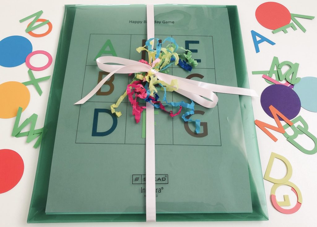 Package the game cards and game markers in a plastic portfolio. Tie with ribbon and confetti.  Send it to the birthday family.
