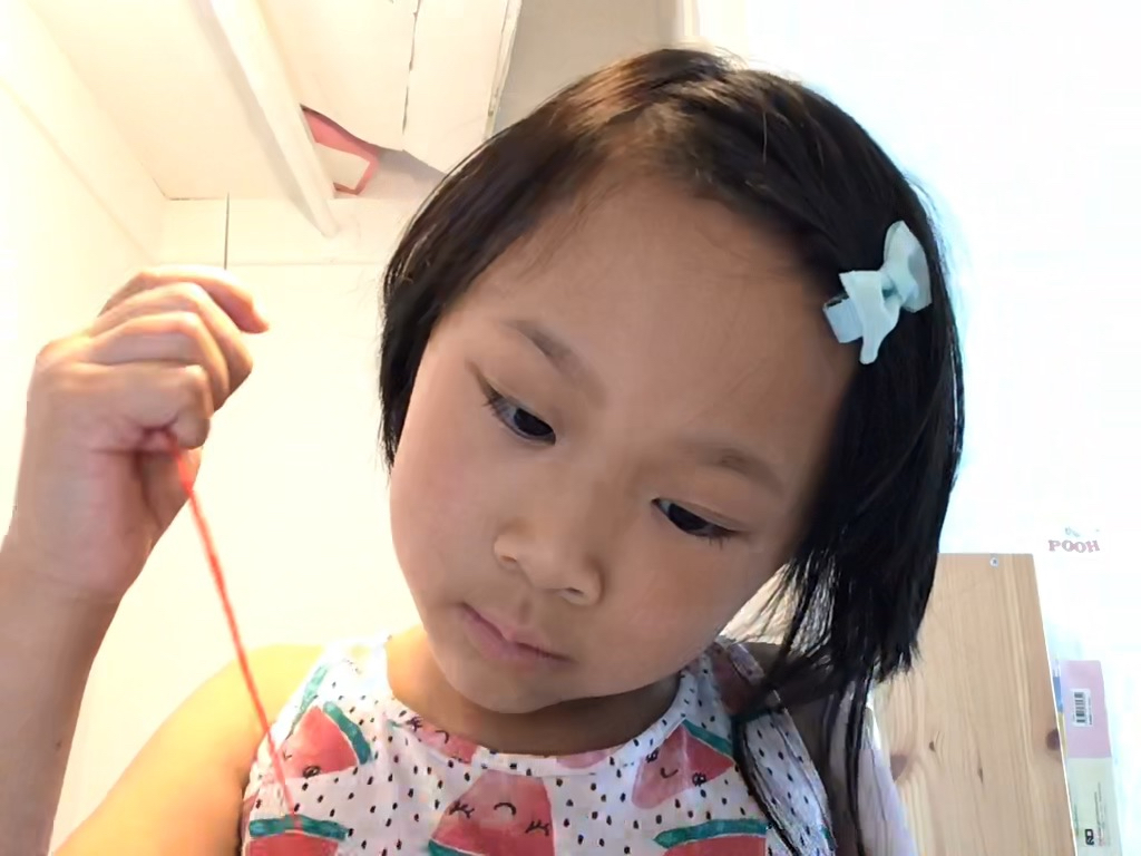 Miss T learns to embroider via a FaceTime session at Camp Grandma.
