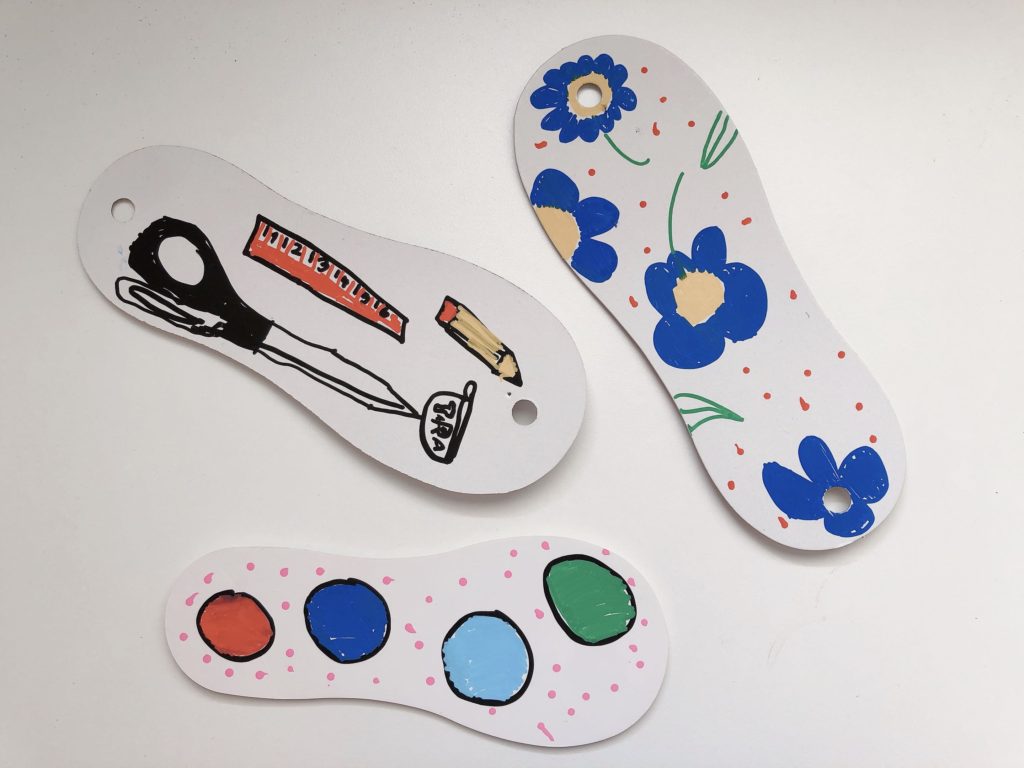 Cardboard stiffeners that come with socks packaging can be decorated for just for fun or to adorn a wall.