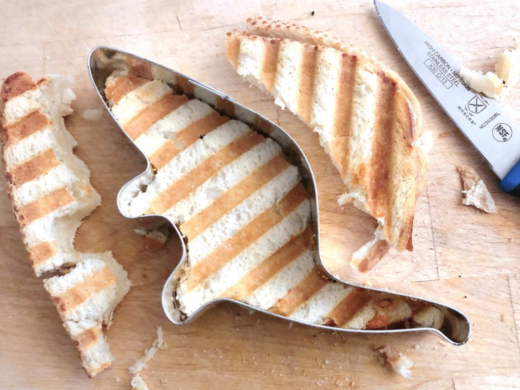 Use a cookie cutter to cut a grilled cheese sandwich into a kid-pleasing shape, like a dinosaur.