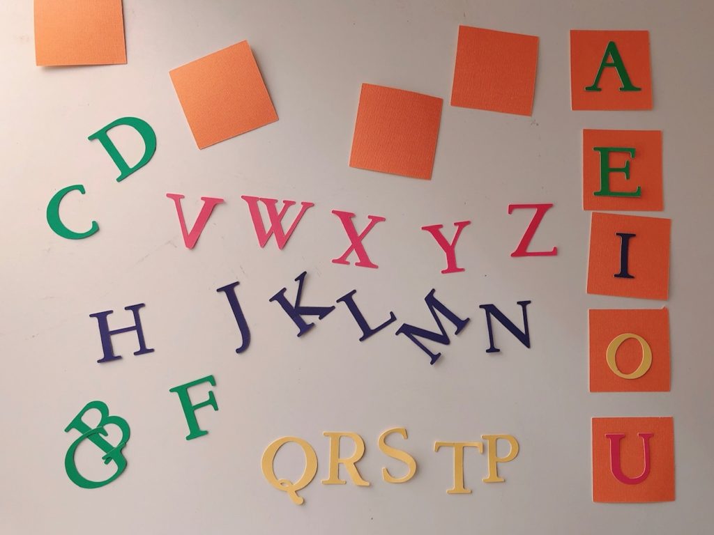 To create a spelling learning game, you need two sets of alphabets and 35 small, cardstock squares.