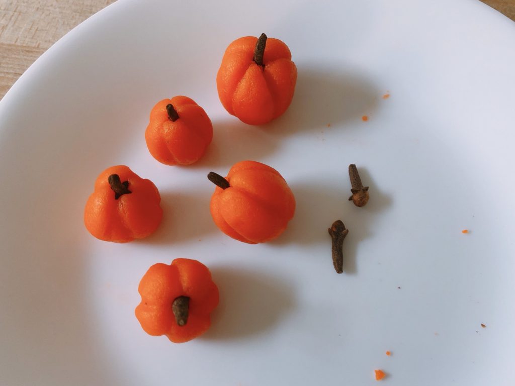 A purchased tube of marzipan is used to make these pumpkins for Halloween cupcakes.
