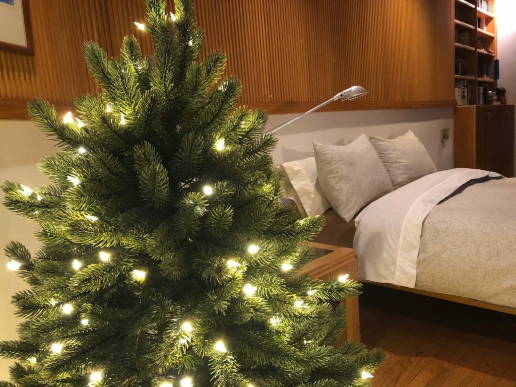 Make Christmas magic with a secondary Christmas tree in the bedroom.  Ours is a discount tree from an outlet.