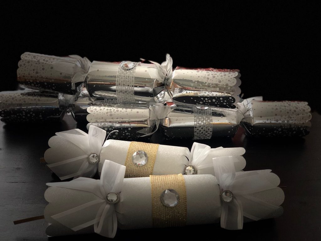 Make Christmas magic with Christmas crackers to set at each place. Inside is a paper crown and a small toy.