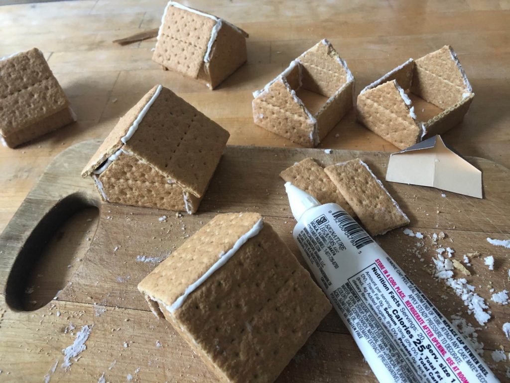 Simple "Gingerbread" houses under construction showing how the walls are put together and how the roof attaches.