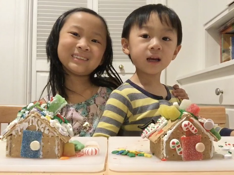 Kids show off their gingerbread houses at the end of the party.