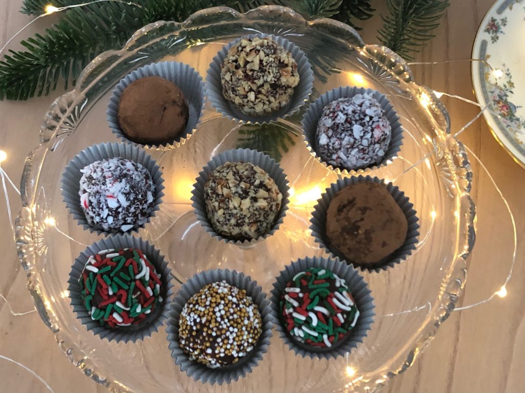 A variety of coatings--crushed candy cane, cookie sprinkles, hazelnuts and cocoa powder--give each truffle an individual look.