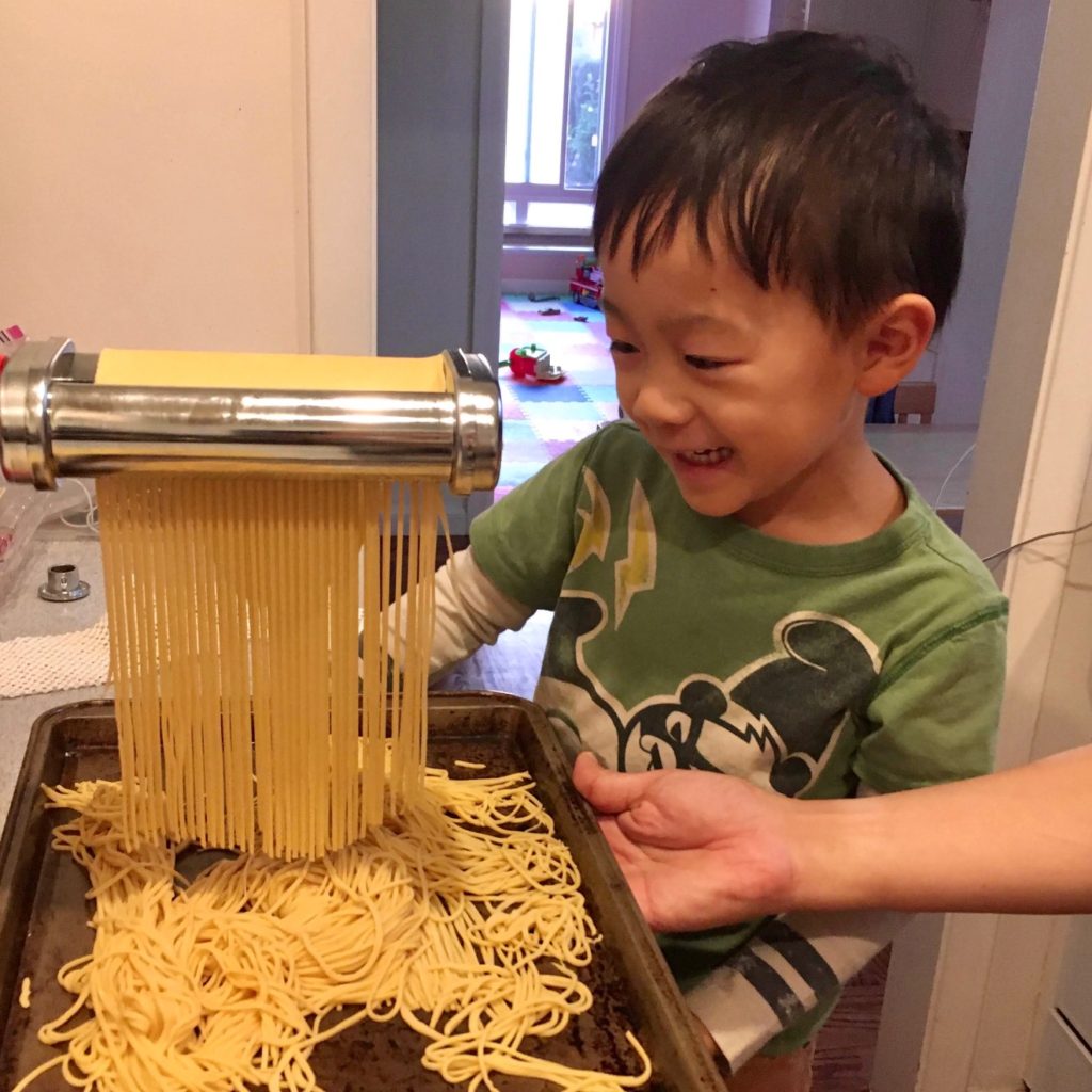 Making pasta is a fascinating project for kids. With an electric machine, be careful with long hair that can get caught in the rollers.