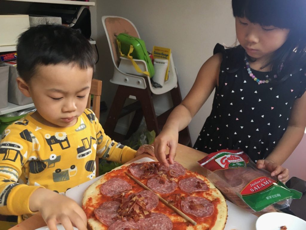 Engage kids in a cooking project, such as making pizza or pasta. They'll hav fun while they customize their dinner.