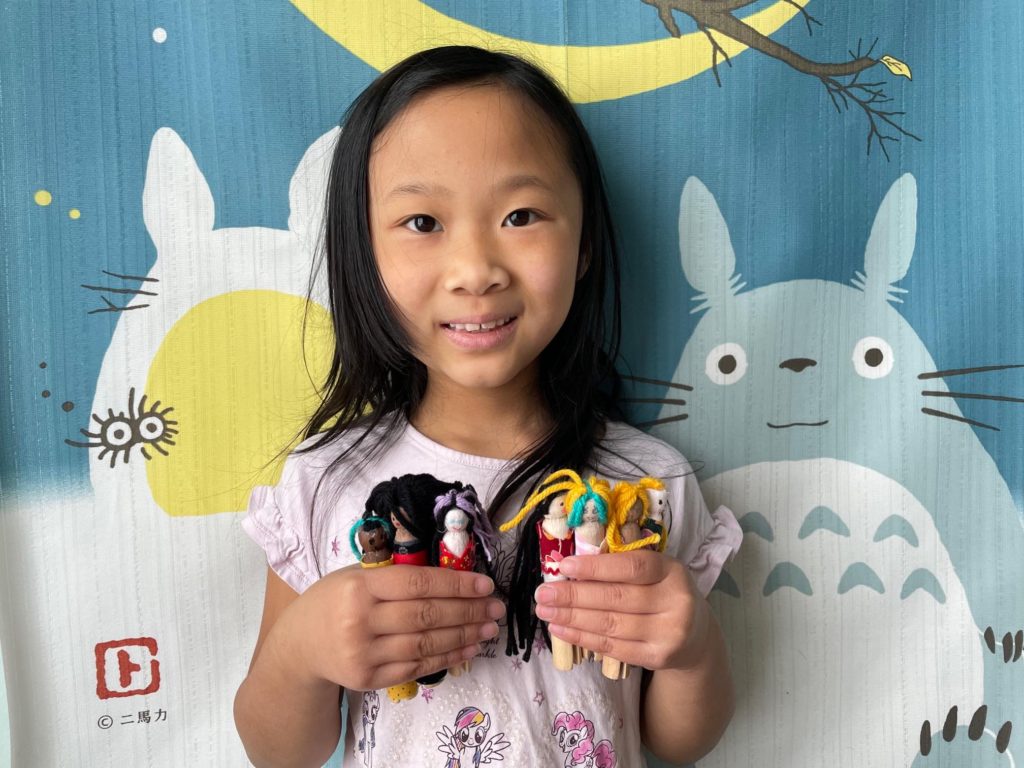 Miss T and her DIY clothespin dolls.