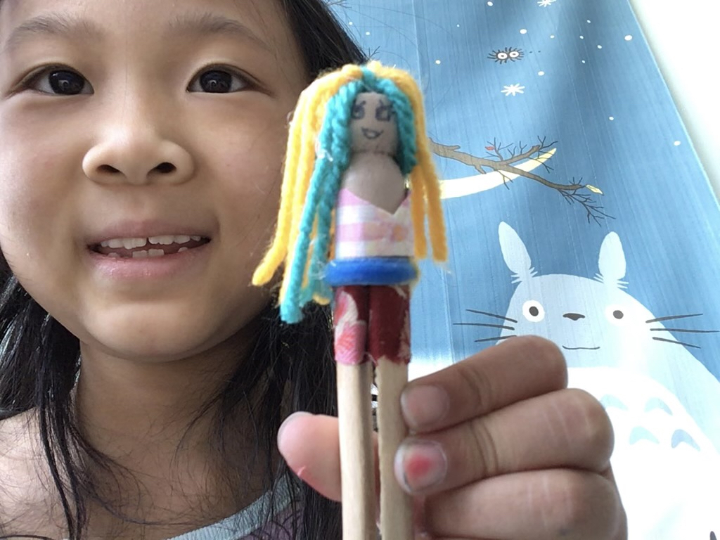 Miss T and her first clothespin doll. Love the eyes and eyelashes.