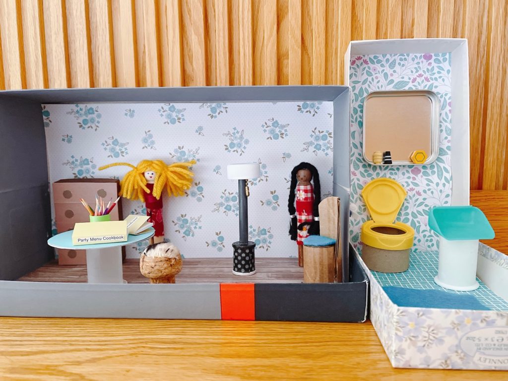 Use boxes and various found objects to make a doll's house for your clothespin dolls.