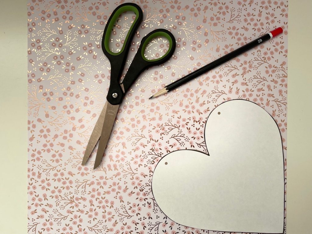 Lay the pattern on cardstock, trace lightly with a pencil, then cut out. This will be the Valentine cover page.
