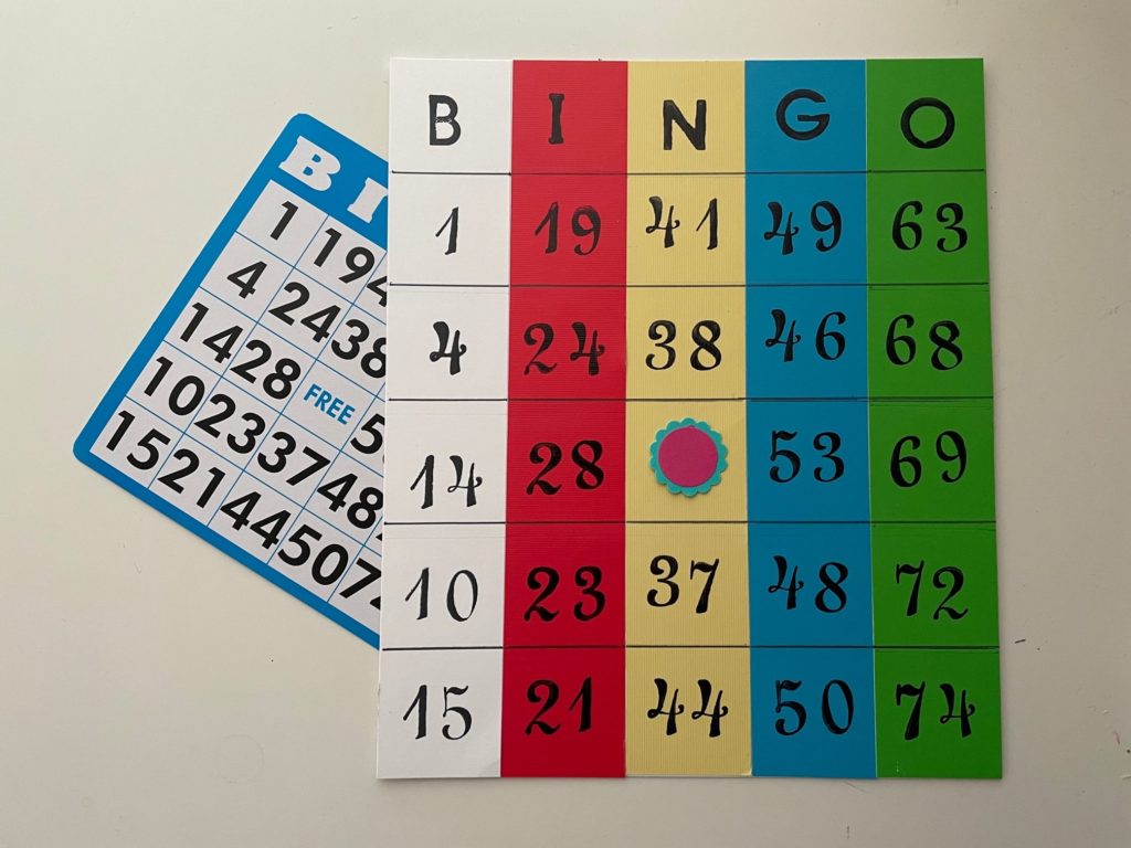 A homemade bingo card with large type and colored columns to help a four-year-old follow the game play.