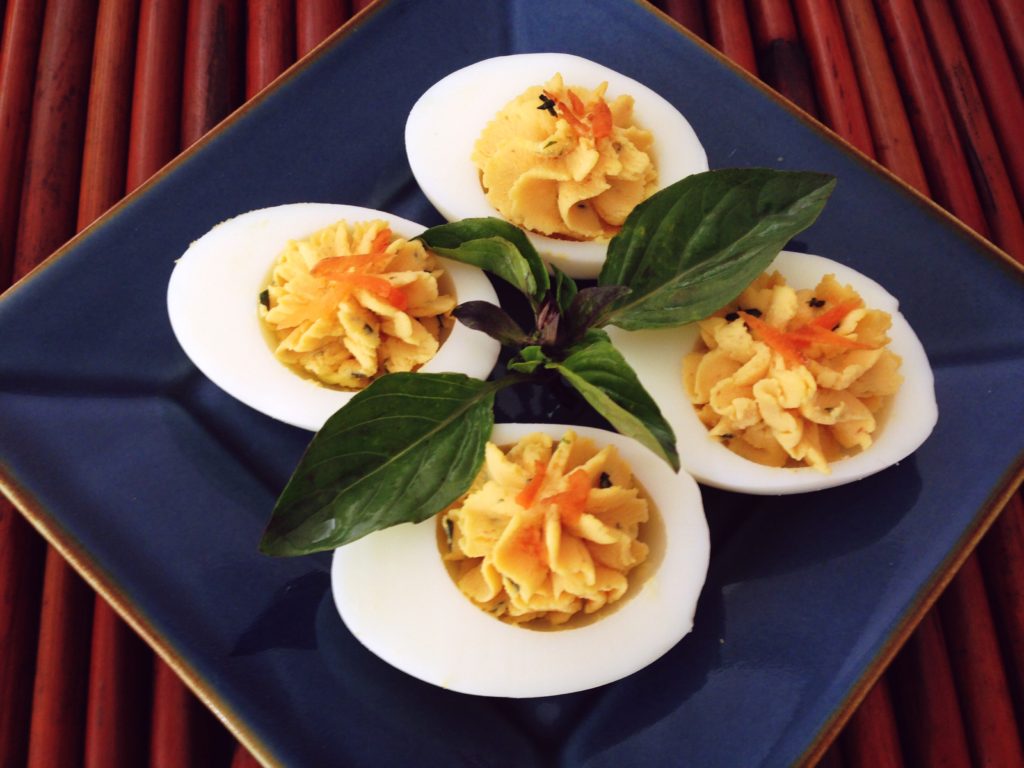 Sriracha Deviled Eggs get some heat from sriracha and a little tang from rice vinegar.