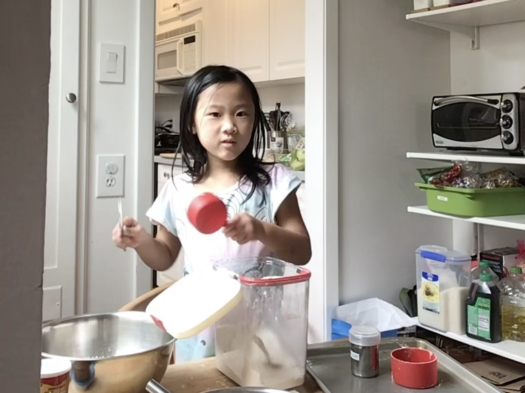 When making Irish soda bread, kids learn the spoon and sweep method of measuring flour into a dry measure cup. 