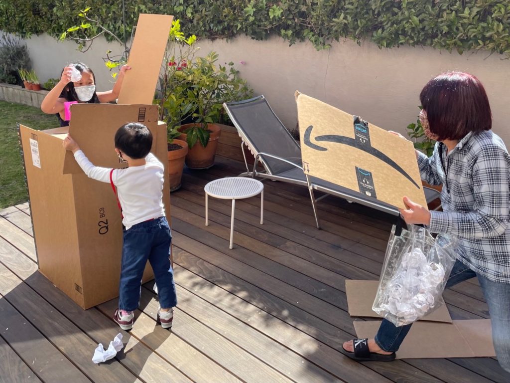 Grandma and grandchild attack the opponent's fork. They use cardboard shields for protection.