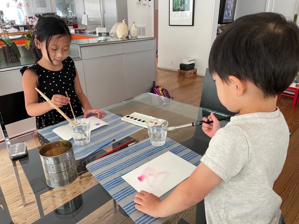 Kids paint with watercolors to make a Mother's Day Card