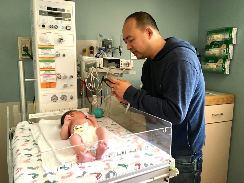 Newborn at the hospital. The journey begins. Two dads share experiences of parenting on a podcast by dads for dads.