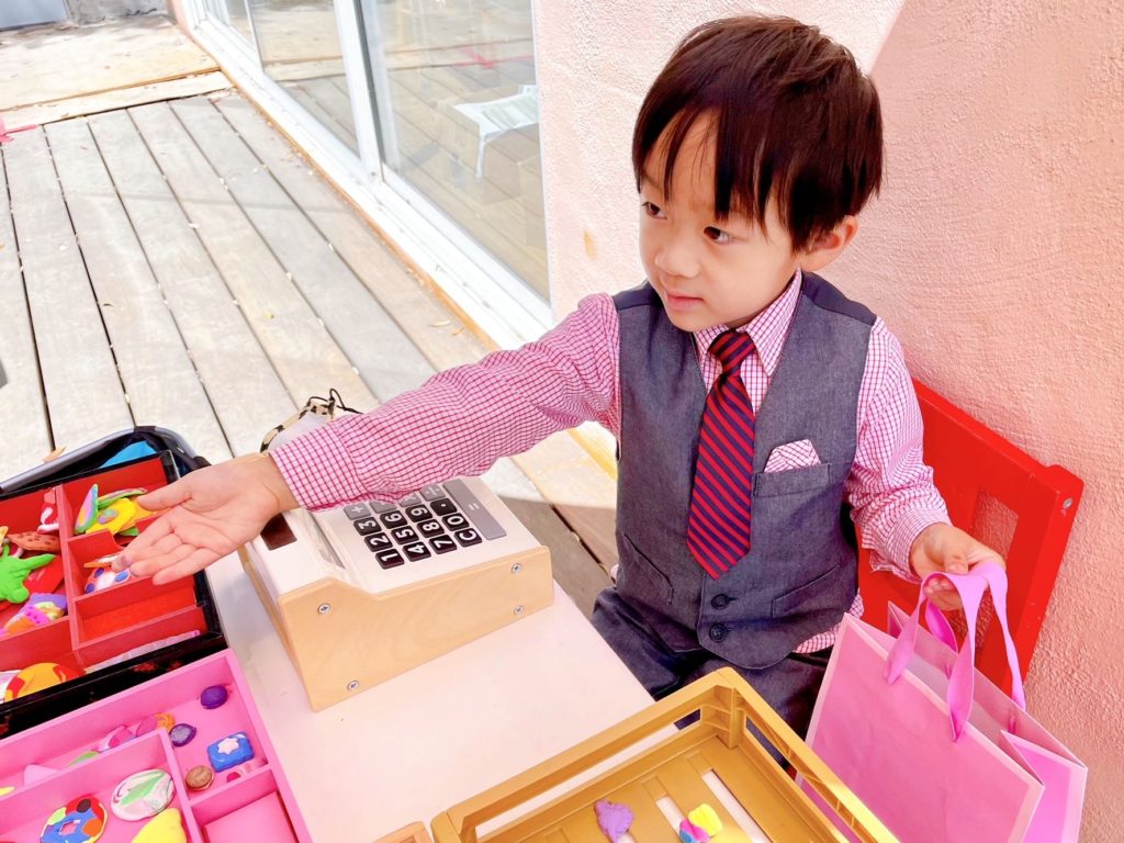 Little N is ready for business at the "Sugars and Dips" cookie shop.