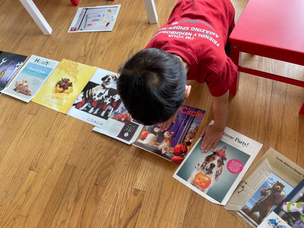 Child lays out magazine imagines on floor to configure a story for a book.This hones logic, creativity and imagination.