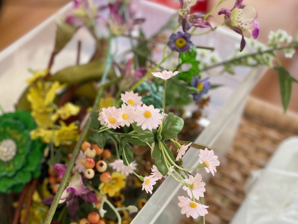 A bin of flowers is handy for decorating surprise balls and other craft projects.