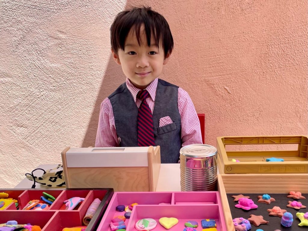 Dress shirt, tie, and vest--Little N is costumed for his role as cookie shop proprietor.