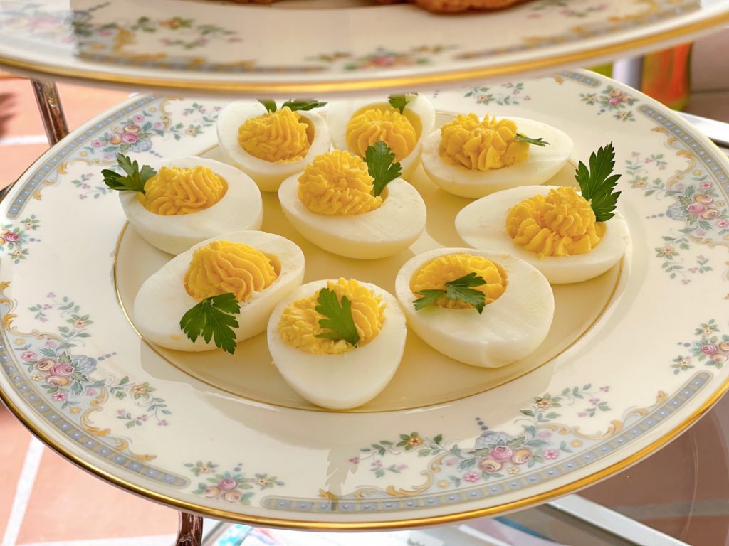Deviled eggs made from start to finish by an eight-year-old. Filling is piped with a star tip.