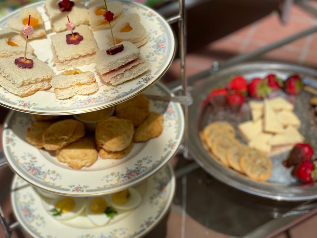 The tea party goodies are arranged on a coffee table in the atrium.