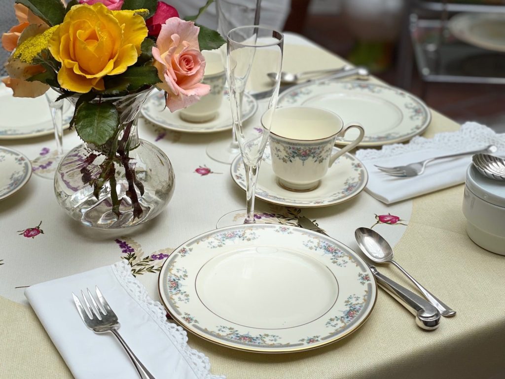 A table set with linens, fine china, and silver, makes a kids tea party extra-special.