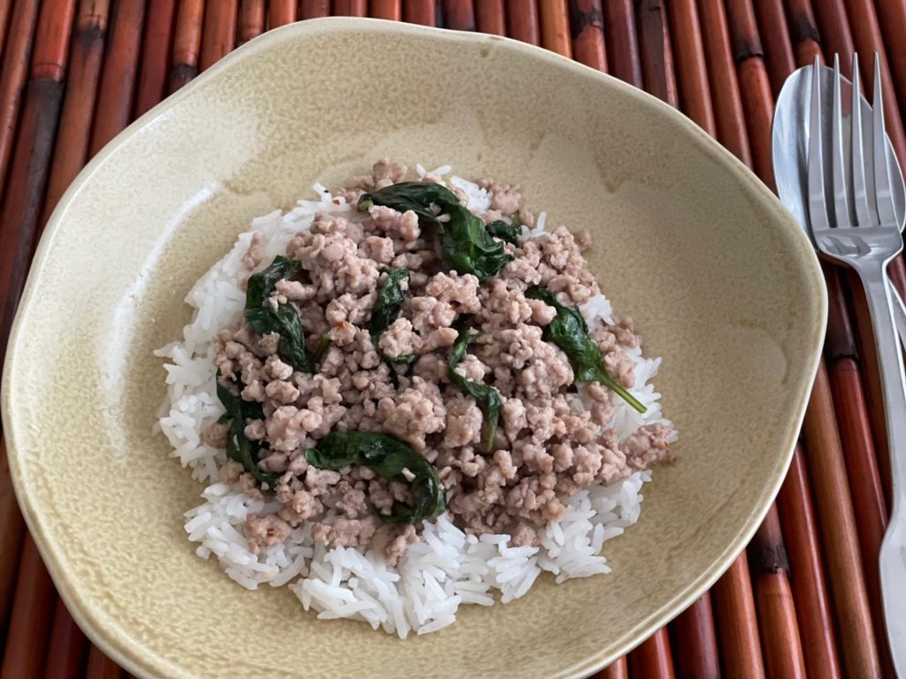 Kra Prao can be served without the sunny-side up egg; it's just as tasty. Basil leaves add flavor and fragrance.