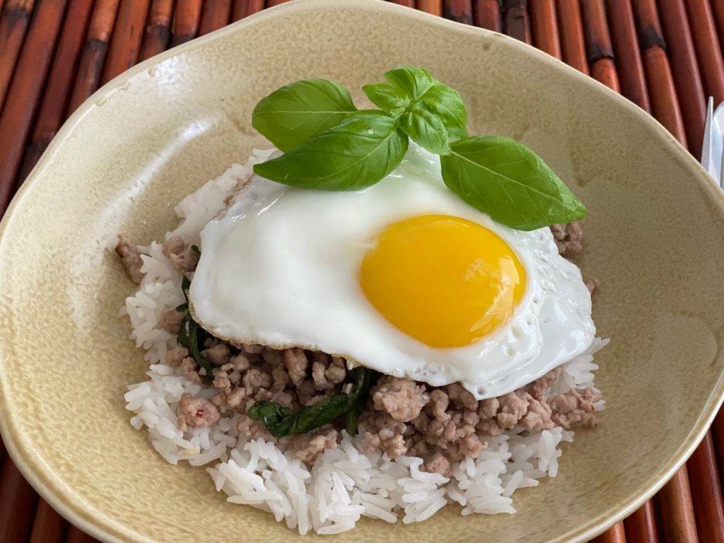 Kra Prao consists of ground pork and basil over rice, topped with a sunny-side up egg. It's made in 20 minutes with five ingredients.