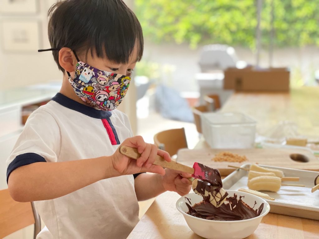 To make chocolate-covered banana pops, spread melted chocolate chips on frozen banana chunks.