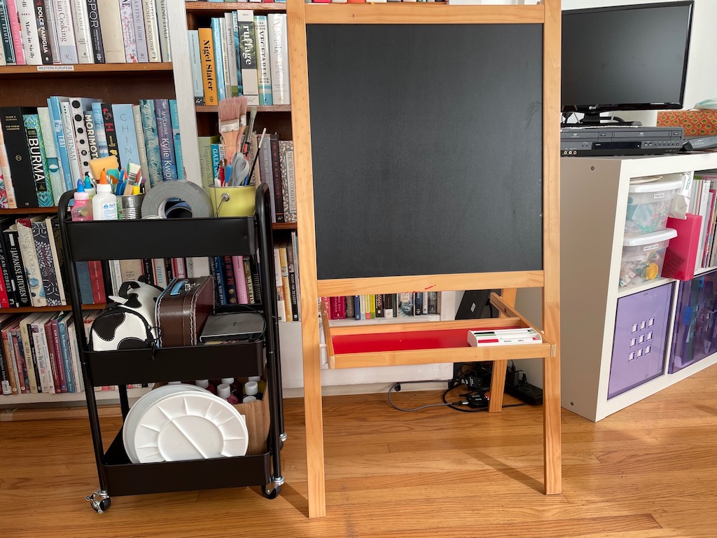 Two useful items: IKEA easel with blackboard and white board; a rolling cart for frequently used tools.